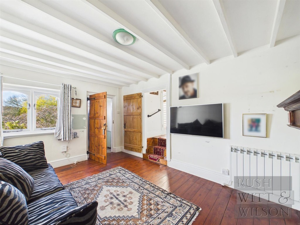 Lot: 123 - SEMI-DETACHED COTTAGE FOR REFURBISHMENT WITH FAR REACHING VIEWS - Further view of living room